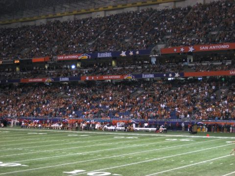 1986 Ford Bronco - A wide view of a football stadium filled with spectators during the Alamo Bowl.