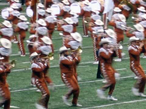 1986 Ford Bronco - A marching band performs on a football field during a game.