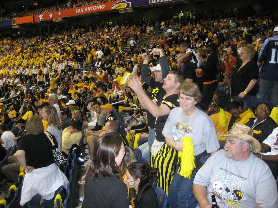 Crowd in stadium seats with San Antonio text visible