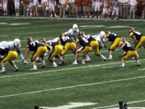 1986 Ford Bronco - A football game is underway with players from two teams on the field.