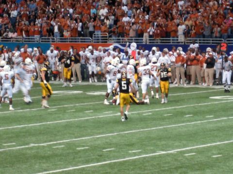 1986 Ford Bronco - American football game in progress with players and spectators.