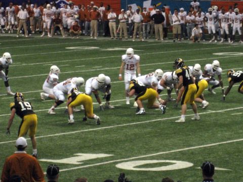 1986 Ford Bronco - A football game is underway with players from two teams on the field.