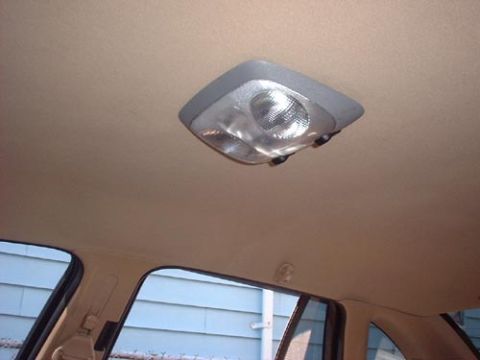 1997 Ford Crown Victoria - The interior dome light is visible against the headliner of the vehicle.