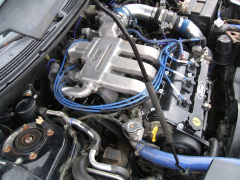 1997 Ford Probe - Close-up view of a car's engine compartment, showing various components and wiring harnesses.