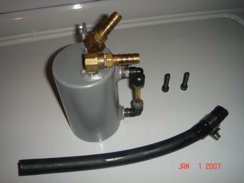 2005 Dodge SRT-4 - Oil catch can kit with fittings and hose shown on a white surface. Date stamp indicates January 1, 2007.