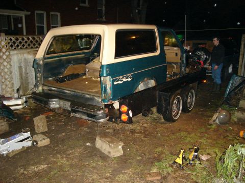 1990 Ford Bronco - This modified Ford Bronco features a flatbed conversion, with its rear end exposed and ready for work.