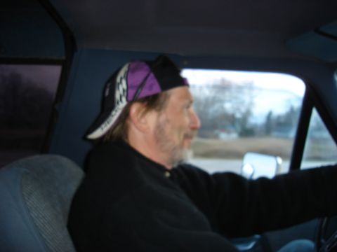 1990 Ford Bronco - Man driving a vehicle, with a Supermotors.net watermark in the corner.