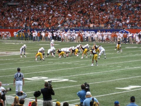1986 Ford Bronco - American football game in a stadium with players on the field and spectators in the stands.