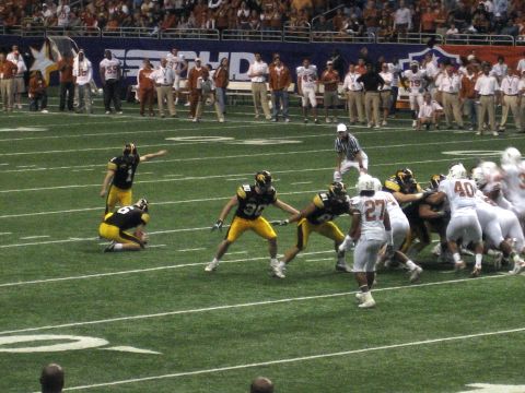 1986 Ford Bronco - A football game is underway with players from two teams on the field.
