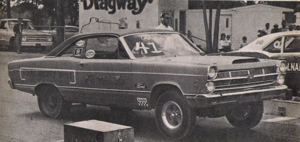 1960s Ford Fairlane coupe with '41' race numbers at a drag strip