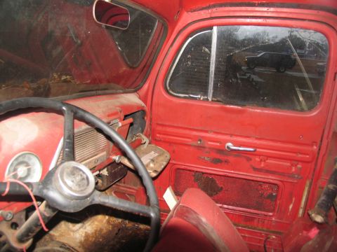 1952 Ford Pickup - Interior view of a 1952 Ford Pickup, with a reflection of a modern SUV in the side window.