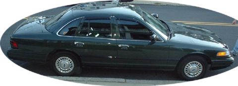 1997 Ford Crown Victoria - This dark green sedan, viewed from the side, shows characteristics of a 1998 model year.