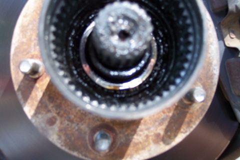 1996 Ford Bronco - This photo shows a close-up view of a rusty manual locking hub assembly, revealing its internal splines.