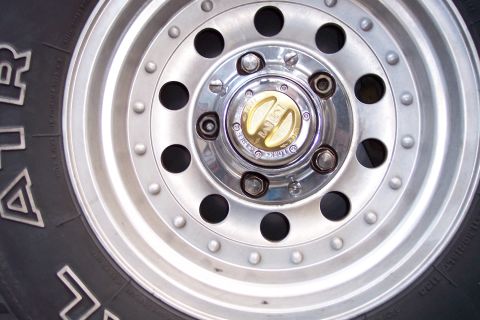 1996 Ford Bronco - A detailed view of a vehicle's wheel and tire, focusing on the hub assembly.