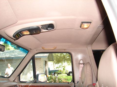 1996 Ford Bronco - Interior view of a 1996 Ford Bronco, including the overhead console and grab handle.