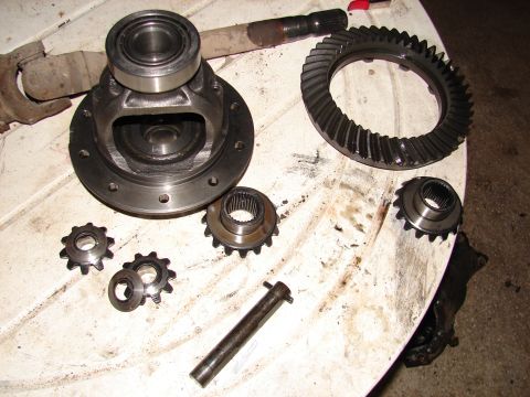 1996 Ford Bronco - Differential gears and housing laid out on a table, likely for repair or inspection.
