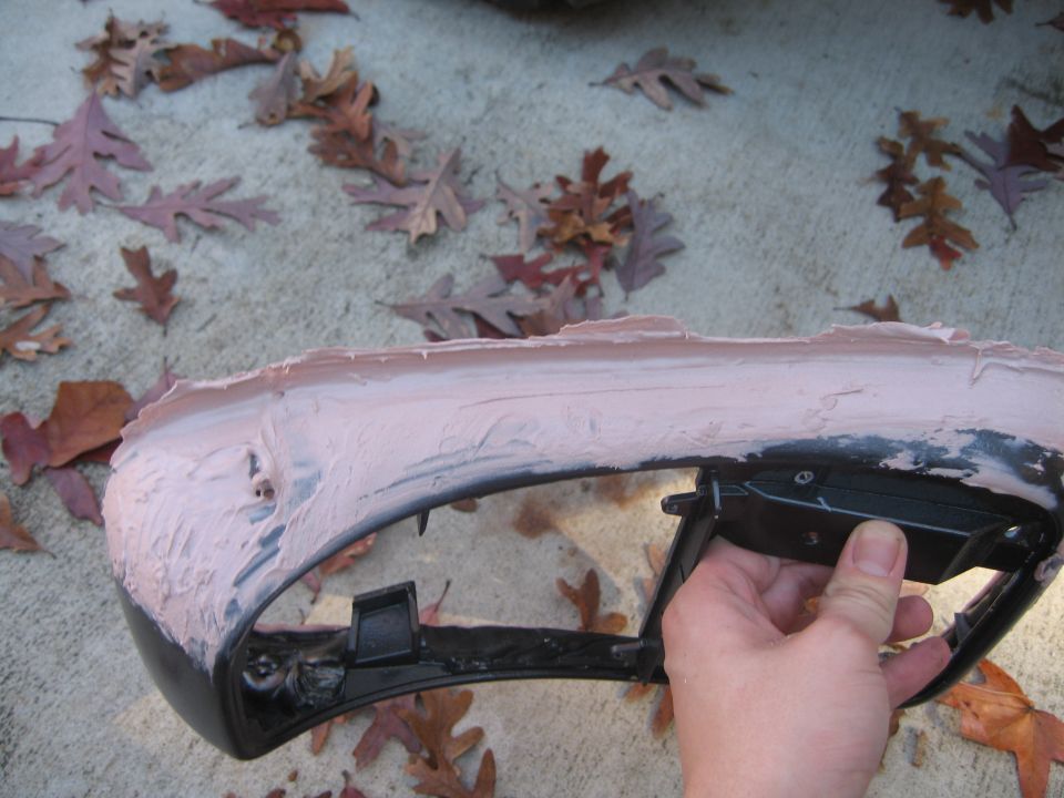 When I first posted pictures, I noticed the large divits in my bondo.  Here i am filling in the voids and perfecting the edge that meets the foor.