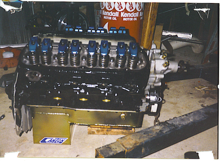 V8 engine block with blue valve covers and Canton oil pan