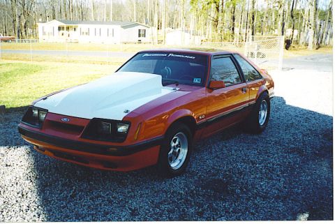 1992 Ford Mustang - This 1987 Ford Mustang features a prominent aftermarket hood and "5.0" badging.