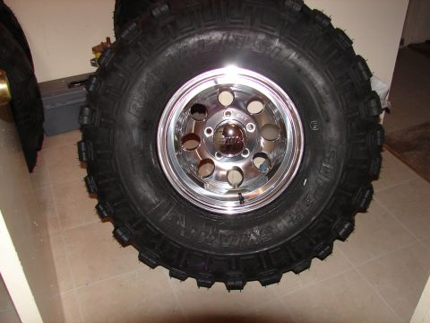 1996 Ford Bronco - This image shows a single off-road tire mounted on a shiny chrome wheel, not a 1996 Ford Bronco.