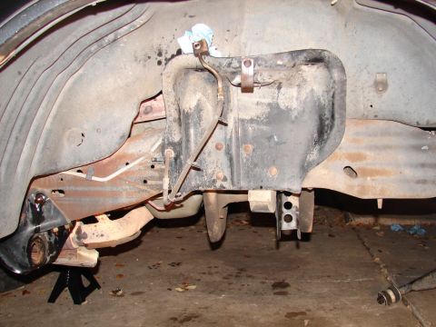 1996 Ford Bronco - Undercarriage view showing suspension and frame components, likely during maintenance.