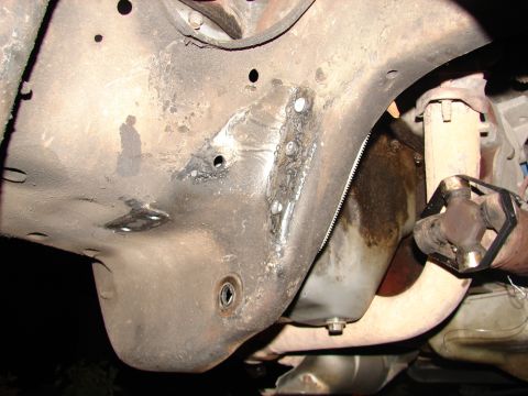 1996 Ford Bronco - Close-up of the undercarriage, focusing on the frame and mechanical components.