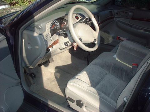 1997 Ford Crown Victoria - Interior view of a car, showing the dashboard, steering wheel, and seats.