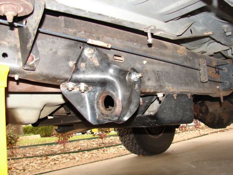 1996 Ford Bronco - Close-up view of the undercarriage of a vehicle, focusing on suspension and frame components.