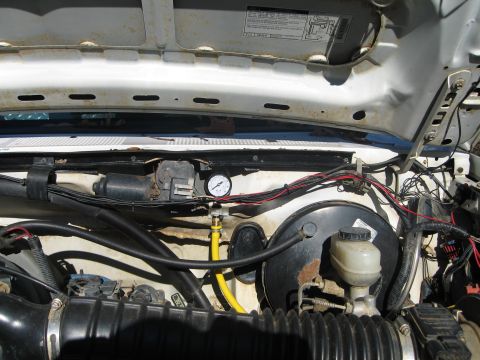1996 Ford Bronco - Here is where the gauge is mounted. Pic taken from a distance to show where it is mounted in relation to the rest of the engine compartment.