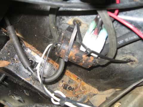 1996 Ford Bronco - This is the aftermarket window washer fluid pump. (Its the black cylinder with the white and black wires)