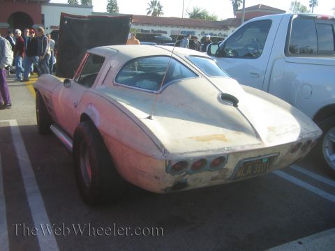 1985 Ford Mustang - This custom Corvette Sting Ray appears to be undergoing modifications at a car show.