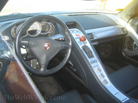 1985 Ford Mustang - Interior view of a Porsche Carrera GT, showing the dashboard and center console.