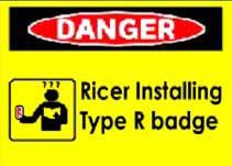 1997 Ford Crown Victoria - A yellow danger sign warns about a 'Ricer Installing Type R badge'.