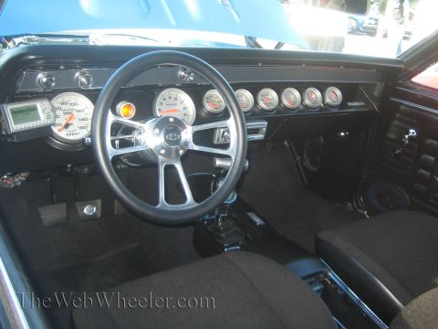1985 Ford Mustang - The interior of a car is shown, focusing on the dashboard and steering wheel.