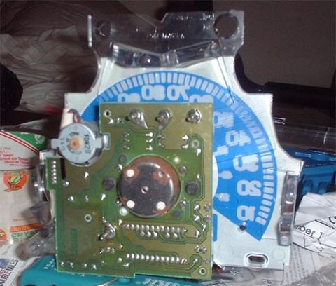 1997 Ford Crown Victoria - A timing light is shown with its internal components and a graduated dial.
