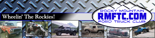Tan Ford Bronco off-roading in mud, front-right quarter view