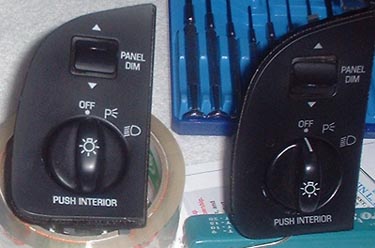 1997 Ford Crown Victoria - Two automotive light switch panels are shown, with a set of screwdrivers visible in the background.