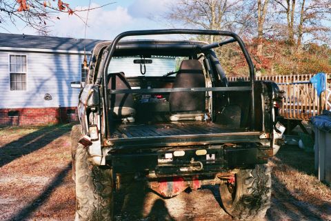 1978 Ford Bronco - This 1978 Ford Bronco is viewed from the rear, its roll cage and tires.