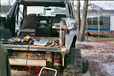 1978 Ford Bronco - This vehicle appears to be undergoing some form of repair or modification, with tools scattered across the rear bed.