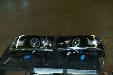 2001 Dodge 1500 - Aftermarket projector headlights are shown, likely for a truck or SUV.