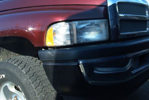 2001 Dodge 1500 - Front passenger side view of a 2001 Dodge 1500 showing the headlight and grille.
