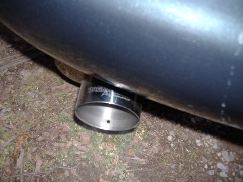 1998 Ford Taurus - Close-up of a chrome exhaust tip Magnaflow Performance branding.