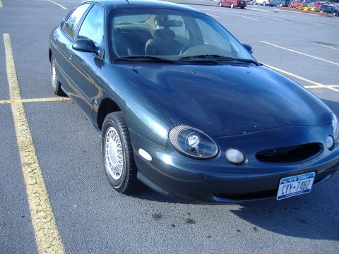 1998 Ford Taurus - This 1998 Ford Taurus is shown from a three-quarter front angle in a parking lot.