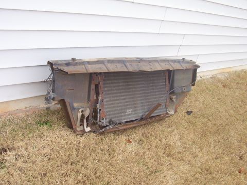 1965 Pontiac Catalina - This radiator and grille assembly appears to be removed from a vehicle, possibly for repair or salvage.