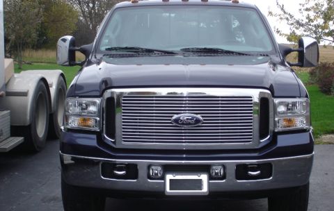 2006 Ford F-350 - This 2006 Ford F-350 Super Duty truck is shown from the front, highlighting its prominent chrome grille and headlights.