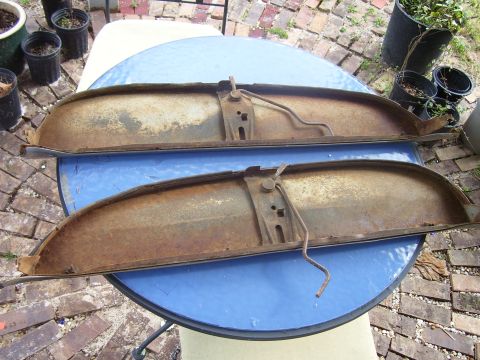 1965 Pontiac Catalina - Pair of old, weathered car parts with visible rust and mounting hardware.