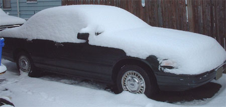 1997 Ford Crown Victoria - A 1997 Ford Crown Victoria is seen here covered in a thick blanket of snow.