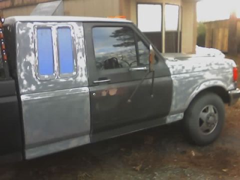 1990 Ford F-350 - This truck appears to be undergoing bodywork, with primer visible on the hood and fender.