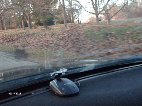 1995 Ford Probe - The photo shows the interior of a vehicle, focusing on the dashboard and a radar detector. A date stamp is visible in the lower left corner.