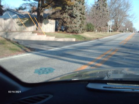 1995 Ford Probe - A view from inside a vehicle shows a road with double yellow lines and orange markings, along with a date stamp of March 14, 2021.